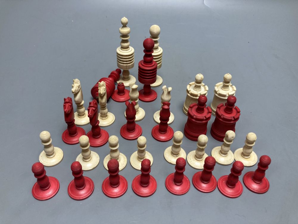 A late 19th century stained natural bone chess set